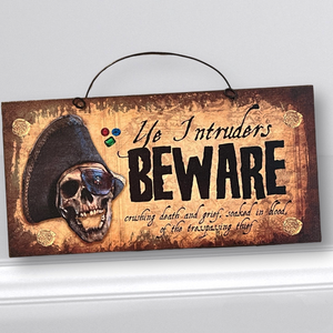 Ye Intruders Beware Pirate sign.