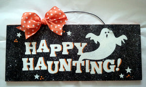 Happy Haunting Halloween sign.