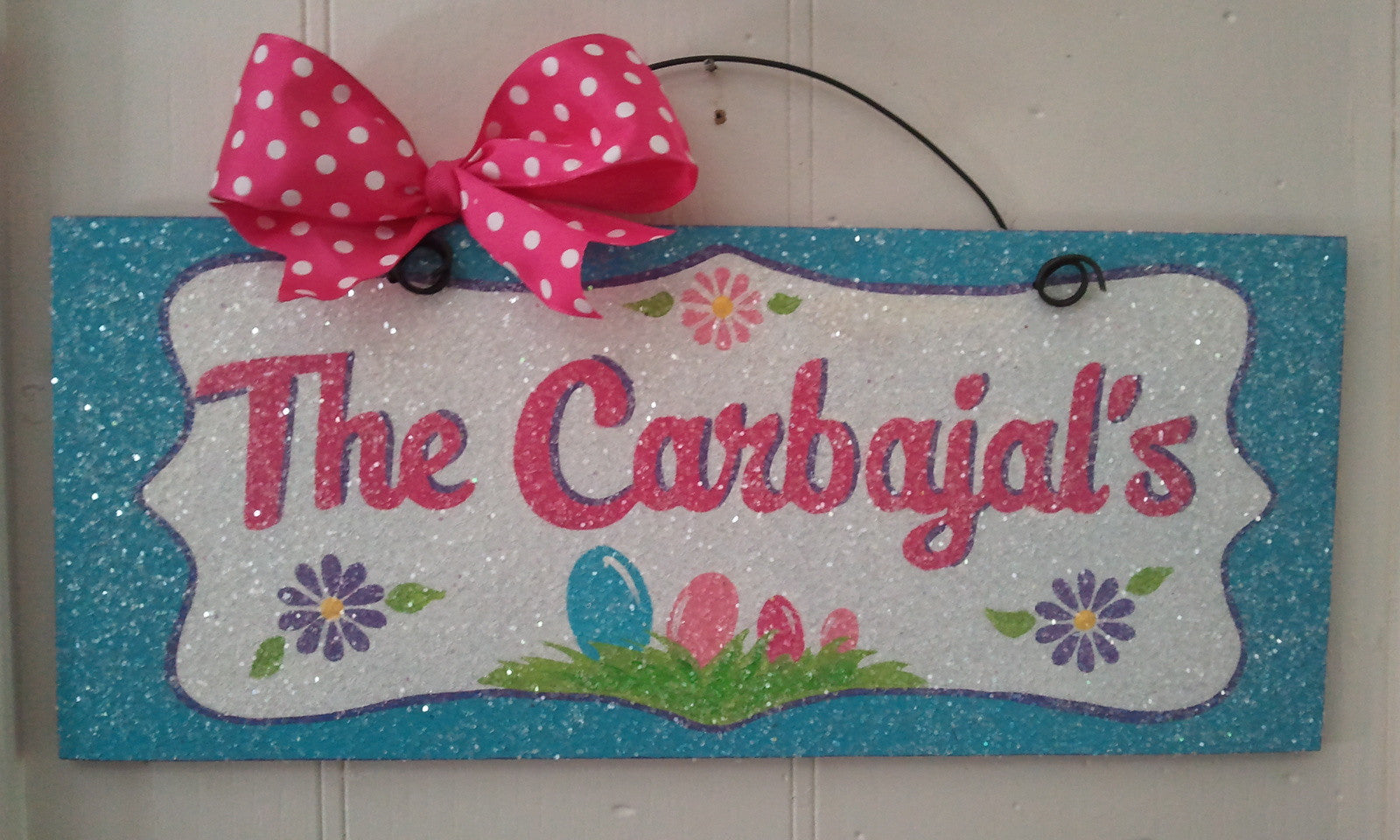 Custom Easter sign with family eggs.