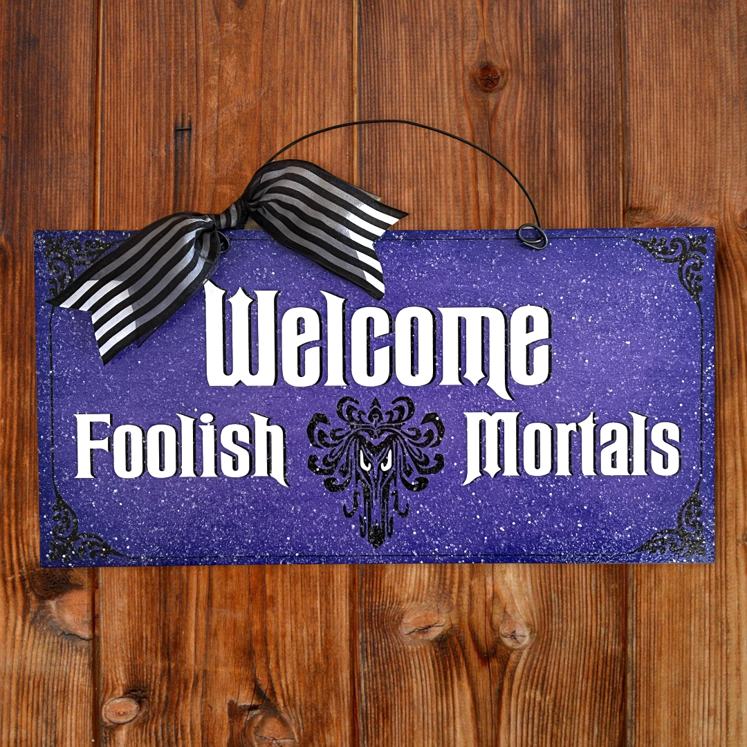 Welcome Foolish Mortals sign.