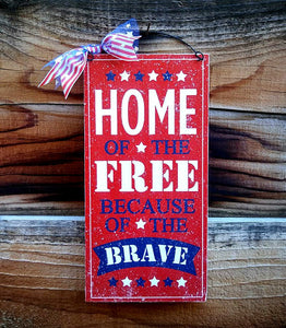 Home of the Free because of the Brave patriotic sign.