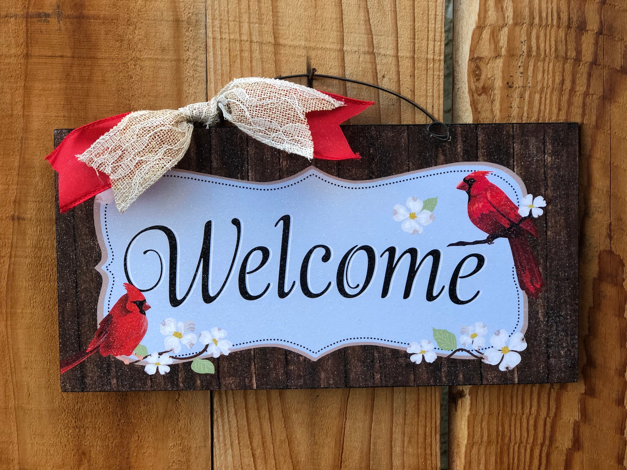 Welcome sign with Cardinals.