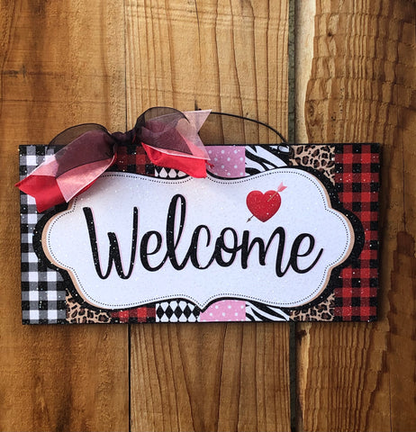 Welcome pattern sign with heart.