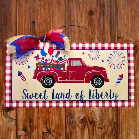 Red truck sign. Sweet Land of Liberty.