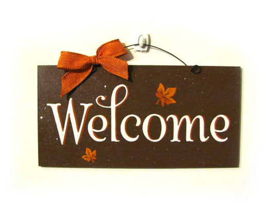 Welcome with fall leaves.
