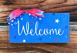 Welcome sign with stars.